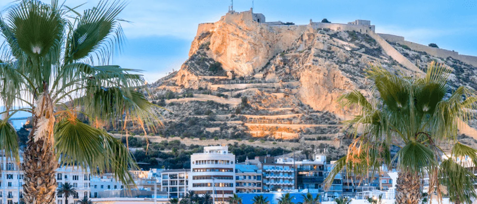 Castillo de Santa Bárbara above Alicante’s marina at dusk